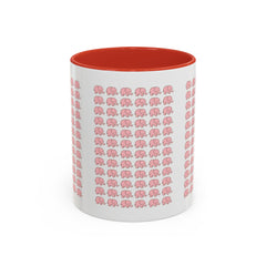 White mug with pink elephant pattern and red interior on a white background