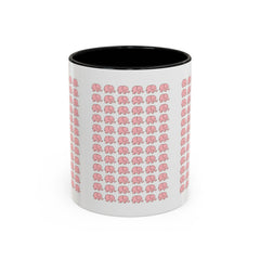 Happy woman enjoying morning coffee in cute pink elephant ceramic mug at kitchen table