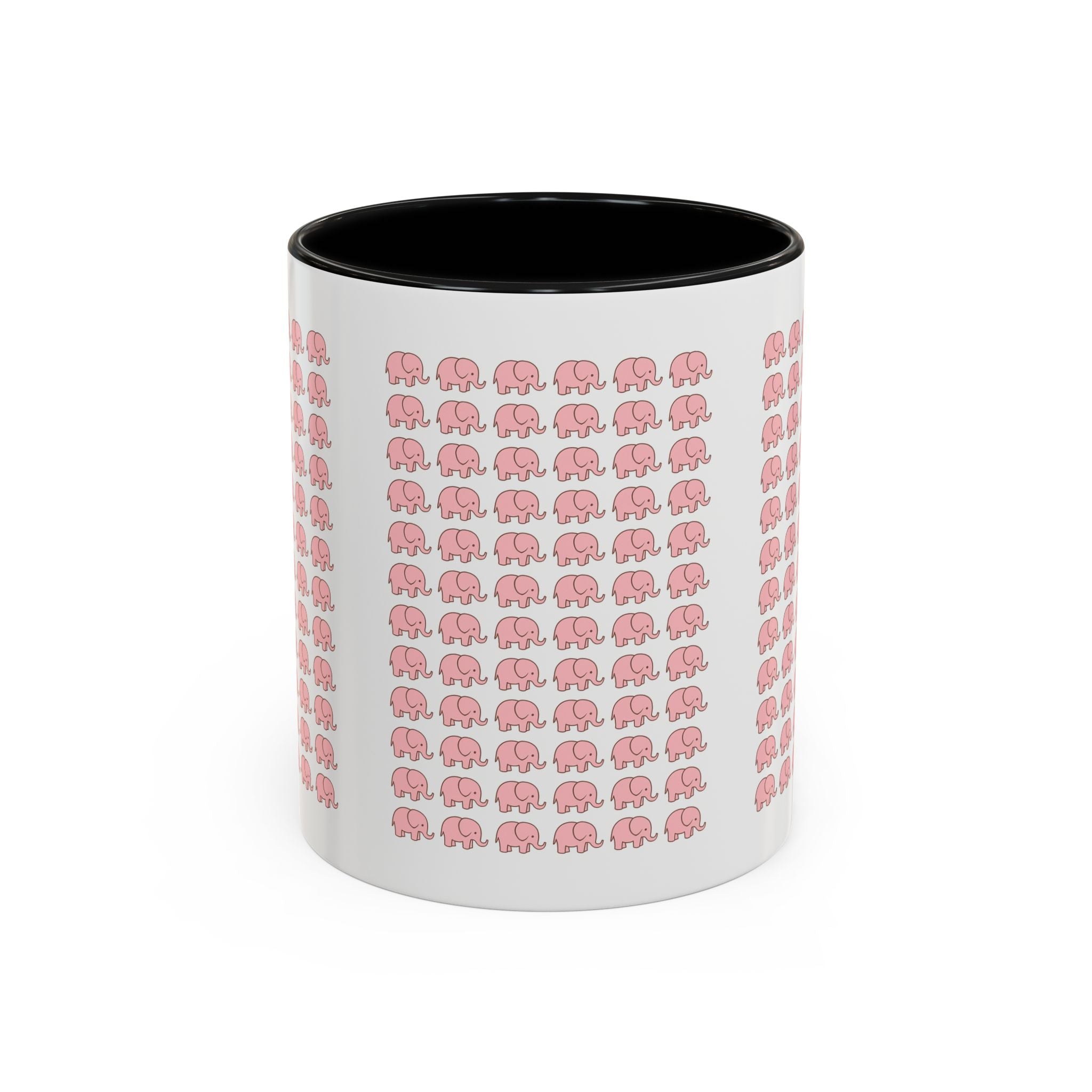 Happy woman enjoying morning coffee in cute pink elephant ceramic mug at kitchen table
